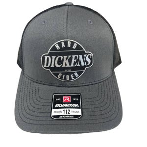 May include: A gray and black trucker hat with a silver logo that says "Hard Dickens Cider" and a red and white Richardson label.