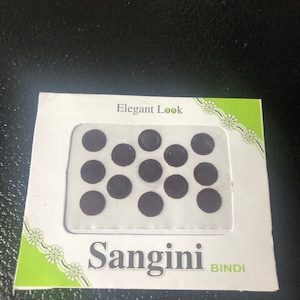 May include: A package of black round bindi stickers with the text "Elegant Look" and "Sangini Bindi" on the front.