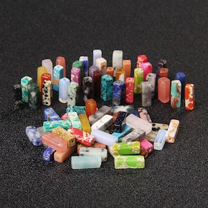 May include: Assortment of colorful, rectangular, gemstone beads. The beads are made of various types of natural stone, including turquoise, agate, and jasper. They are perfect for jewelry making, crafting, and home decor.