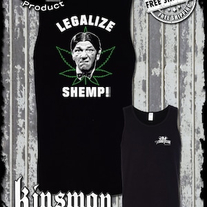May include: Black sleeveless tank top with a white graphic of a cartoon character with the text "Legalize Shemp!" and a green marijuana leaf. The Three Stooges logo is in the upper left corner.