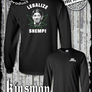 May include: Black long-sleeve t-shirt with a white graphic of Shemp from The Three Stooges. The graphic features Shemp with a marijuana leaf and the text "Legalize Shemp!"