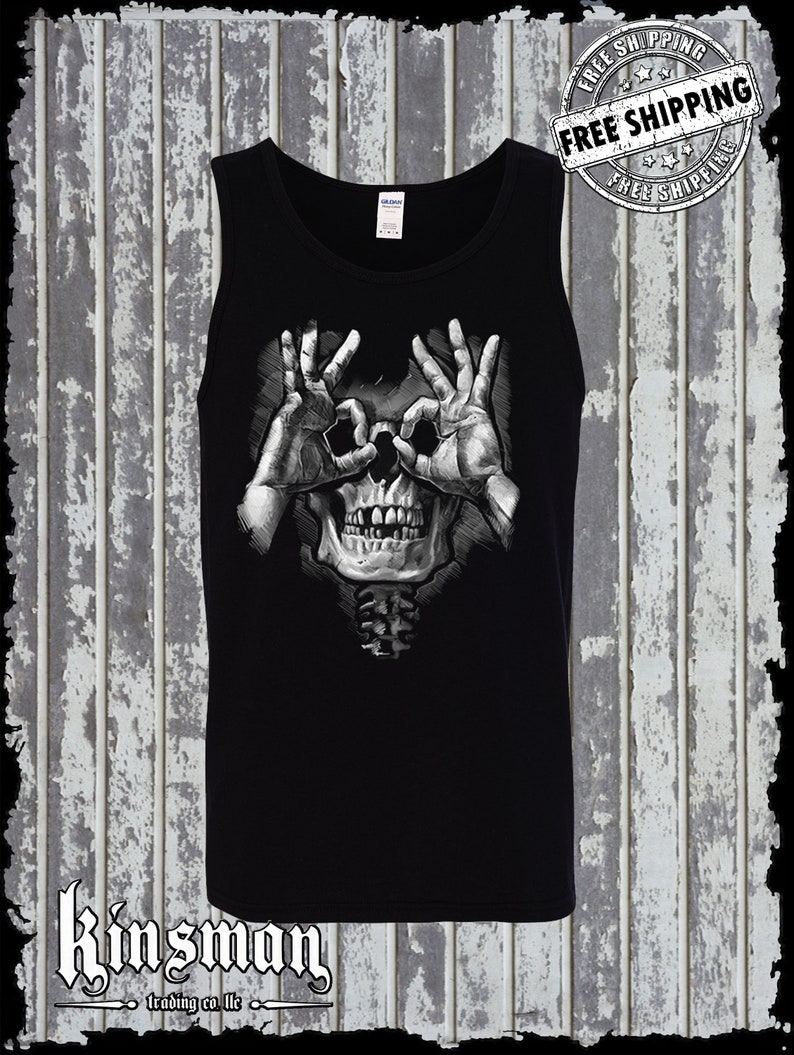 May include: Black tank top with a graphic of a skull with hands making the 'OK' sign over the eyes.