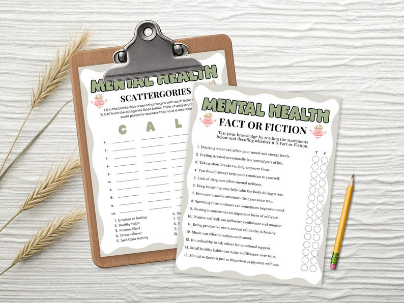 May include: A brown wooden clipboard holding a Mental Health Scattergories game sheet and a separate Mental Health Fact or Fiction game sheet with a yellow pencil. Both sheets feature green headers, wavy borders, and pink brain illustrations.