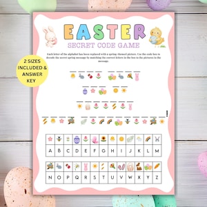 Peut inclure: Jeu de code secret sur le thème de Pâques, avec une bordure rose et des illustrations de lapins et de poussins. Le jeu, avec le texte "EASTER SECRET CODE GAME", est posé sur un fond blanc, entouré d'œufs de Pâques pastel. Comprend une clé de réponse.