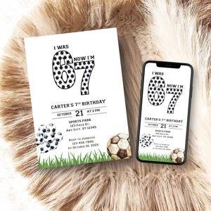 May include: A birthday invitation and a smartphone displaying the same design. The invitation and phone screen feature the text "I WAS 6 NOW I'M 7" with soccer ball-themed numbers. Additional text includes the birthday details: date, time, location, and RSVP information.