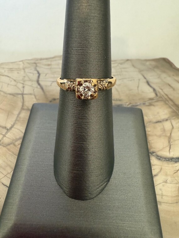 14 karat yellow gold, round solitaire engagement ring