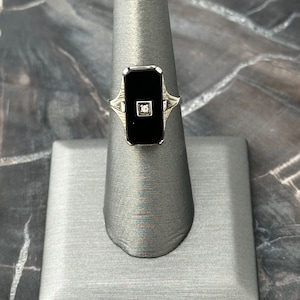 14 Karat white gold rectangular onyx ring with diamond accent
