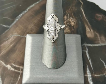 18 karat white gold, vintage, 3 diamond filigree ring.