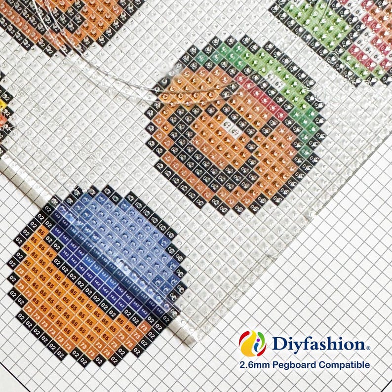 May include: Close-up of a DIY craft project with colorful square beads arranged on a grid. The image shows a partially completed design with various colors, including orange, green, and blue. The text "Diyfashion" and "2.6mm Pegboard Compatible" are visible.