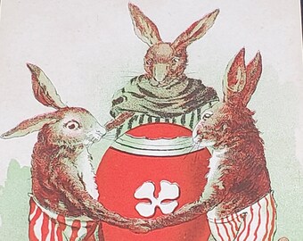 Cartolina di Pasqua: Un gioioso periodo pasquale Coniglietti che danzano intorno a un uovo di Pasqua 3120