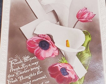 May include: A vintage Easter postcard with a white cross and flowers. The text reads "May Easter Joy Be Thine."  "Fresh Hopes, fresh Joys, may this Easter bring, Fresh Thoughts for each coming morrow, I pray that it bring you songs of Peace, To banish every Sorrow."