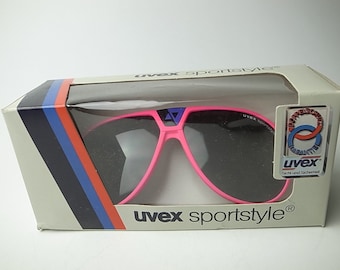 NOS Vintage 80s UVEX Sportstyle 55 gafas de sol de neón rosa hechas a mano en Alemania Occidental Calidad increíble en caja Leyenda 100% original