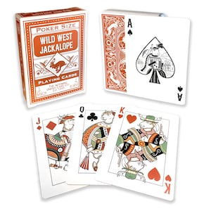 May include: A deck of "Wild West Jackalope" poker-size playing cards. The orange box features a jackalope illustration. The cards have unique illustrations of jackalopes as face cards. The Ace of Spades features a jackalope with a town in the background.