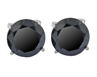 May include: A pair of black diamond stud earrings with silver settings.