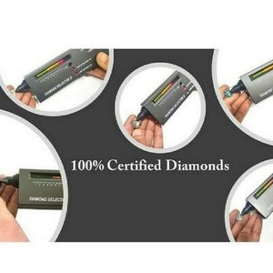 May include: A diamond tester with a digital display and the text "Diamond Selector Z" is used to test the authenticity of diamonds. The tester is held in a hand and is being used to test a diamond.