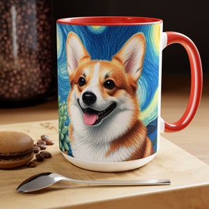 May include: A white ceramic mug with a red interior and handle, featuring a corgi dog illustration in the style of Van Gogh's "Starry Night." The mug has a happy corgi with a blue and yellow background.