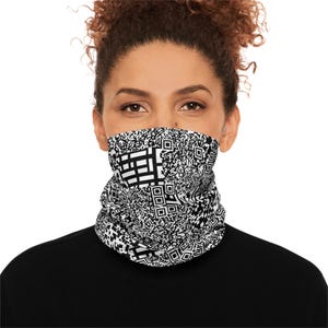 May include: Black and white neck gaiter with a repeating QR code pattern. The neck gaiter is worn around the neck and covers the lower face. The background is white.