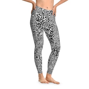 May include: Black and white leggings with a repeating QR code pattern. The leggings are high-waisted and form-fitting, with a bold, graphic design. The pattern covers the entire surface of the leggings.