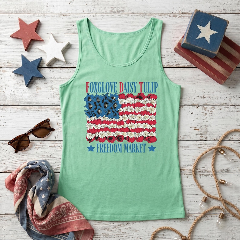 Tank top featuring a floral American flag design and text.