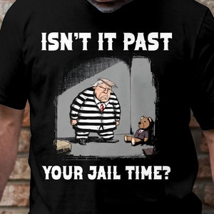 May include: A black and white illustration of a person in a prison uniform standing in a cell with a teddy bear. The text "ISN'T IT PAST YOUR JAIL TIME?" is below the image.