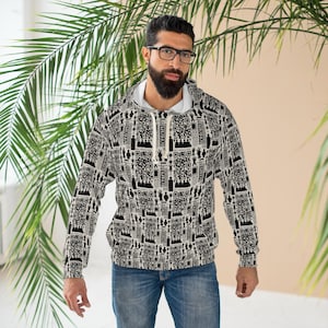 May include: A black and white patterned hoodie with a white interior. The design features a repeating pattern of QR codes and other graphic elements. The hoodie has a drawstring and is worn with blue jeans.
