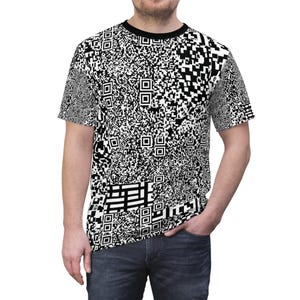 May include: A black and white QR code patterned t-shirt. The short-sleeved top has a black crew neck and is worn by a person. The design covers the entire shirt, including the sleeves. The pattern is made up of various QR codes.