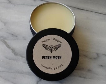 Death Moth: Solid Fragrance, Copper + Copper Nonbinary Blend. Patchouli Blend.