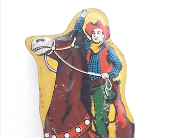 1950's Tinplate whistle with lithograph of a cowboy on his horse. Made in Japan.