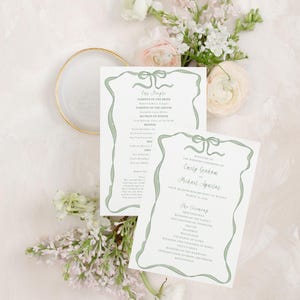 May include: A wedding ceremony program with a green ribbon design. The program lists the names of the wedding party, the ceremony order, and the names of the bride and groom: Emily Graham and Michael Aguilar.