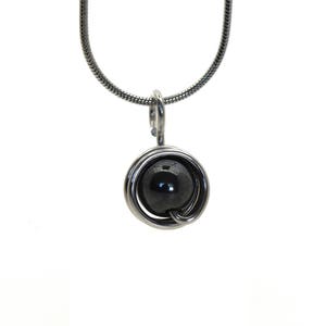 Aluminum wire decorated with a hematite bead pendant, mounted on a stainless steel snake chain, light weight, classical, black grey