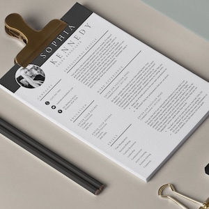 May include: A black and white resume template with a professional profile, contact information, education, work experience, and skills sections. The resume is for a sales associate named Sophia Kennedy.
