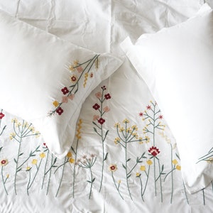 White embroidered top pillow shams
