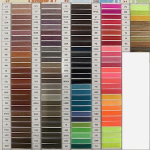 May include: A color chart of embroidery floss with numbers and thread names. The chart is divided into 10 columns, each with a different color of thread. The colors range from light to dark, and include shades of red, orange, yellow, green, blue, purple, brown, black, and white.