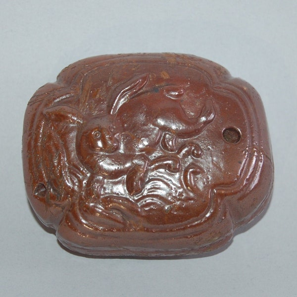 Vintage stoneware suiteki water dropper with brown glaze, rabbit jumping on waves, Japan