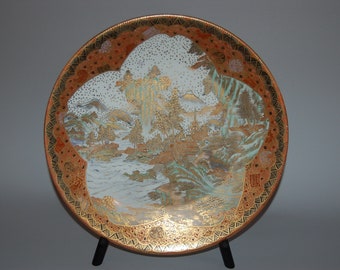 Satsuma porcelain charger, landscape with pagoda, waterfall, mountains inside cherry blossom outline, Japan