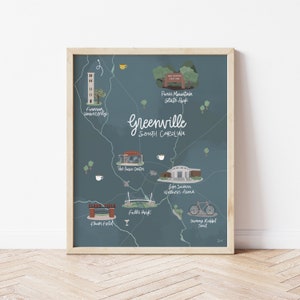May include: A blue illustrated map of Greenville, South Carolina, with landmarks and points of interest, including Furman University, Paris Mountain State Park, The Peace Center, Falls Park, Ben Secour Wellness Arena, Fluor Field, and Swamp Rabbit Trail.