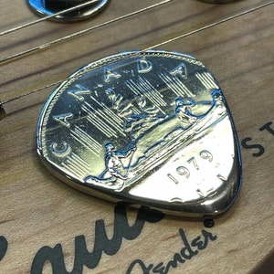 Hand Cut Guitar Pick From A Canadian Nickel Dollar