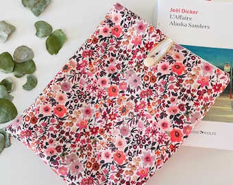 Padded fabric book cover with button closure, protective cover for paperback books. Small flowers.