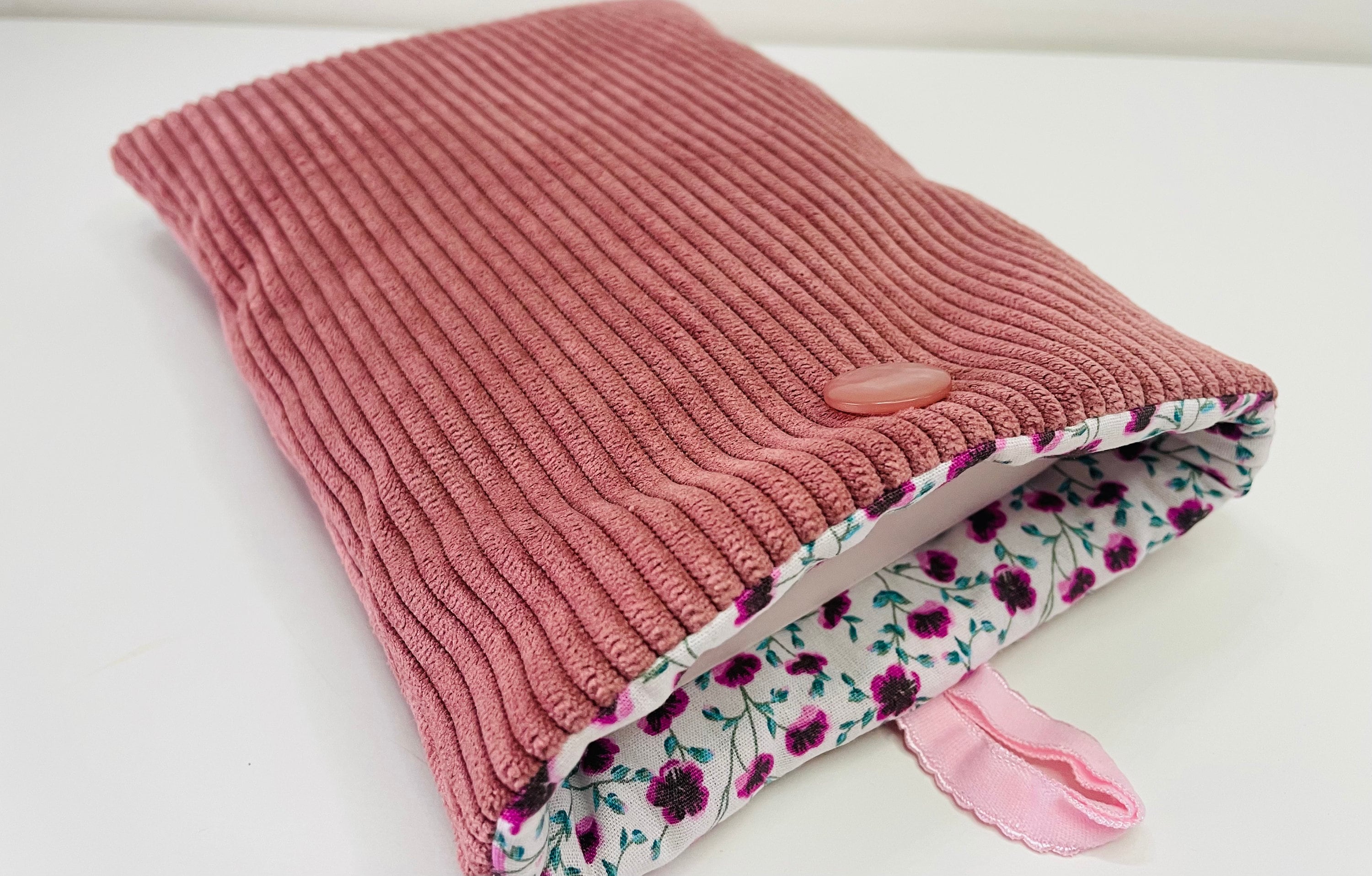 Padded fabric book pouch with button closure, pocket-sized book cover. Old pink corduroy