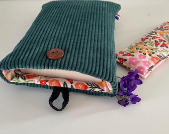 Padded fabric book sleeve with button closure, protective cover for pocket-sized books. Green corduroy and floral fabric