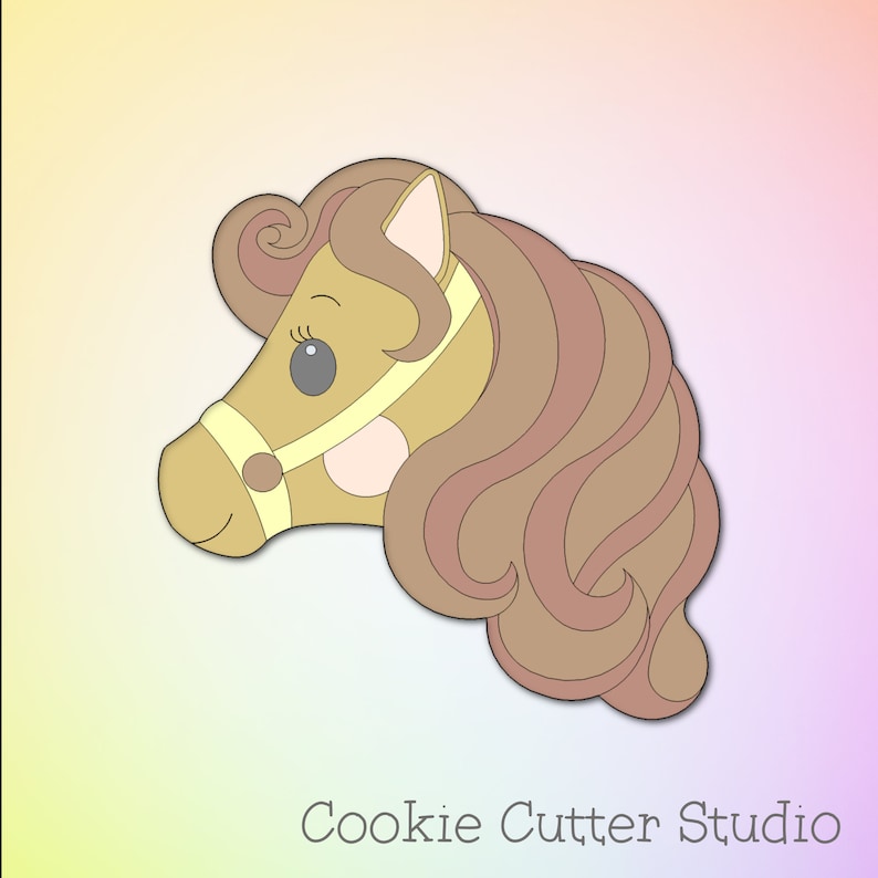 May include: A brown and pink horse head cookie cutter with a yellow bridle. The horse has a curly mane and a large eye.
