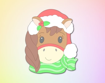 May include: A brown horse wearing a red Santa hat with white trim, a green and white striped scarf, and a holly sprig.