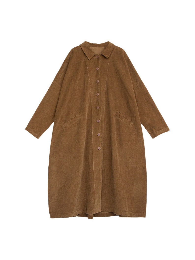 May include: A long brown corduroy shirt with a button-up front and long sleeves.