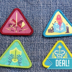 May include: Four triangular embroidered patches with different designs. The patches are on a blue denim background. The designs include a sword and shield, a book with flames, a snake with wings, and a sword with a cross.