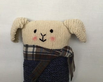 Handmade beige soft plush knitted bunny cushion , dark blue body with tartan scarf.