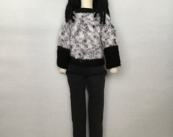Handmade fabric doll/ person, long black hair, black denim jeans,fleck white/black jumper and burgundy boots.