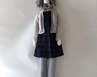 Handmade fabric doll/ person ,mid brown hair grey jeans and cardigan, navy shoes and tunic , multi colour scarf.