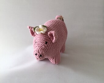 Handmade pink piggy with daisy flower.