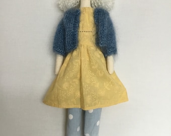 Handmade fabric doll/ person ,white long wavy hair, yellow dress ,blue shoes, trousers headband and cardigan.