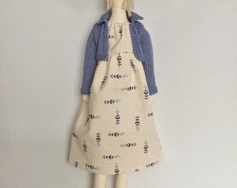 Handmade fabric doll/ person beige updo cream dress/ blue pattern, navy shoes and mid blue cardigan.